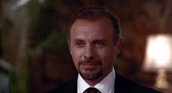 Movie still from “Pretty Woman” (1990), directed by Garry Marshall – A person wearing a suit and tie; Close Up shot, Low angle