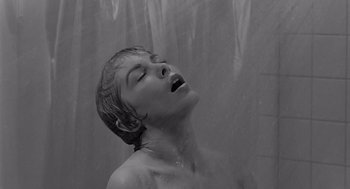 Movie still from “Psycho” (1960), directed by Alfred Hitchcock – A woman is taking a shower in the rain; Close Up shot, Low angle