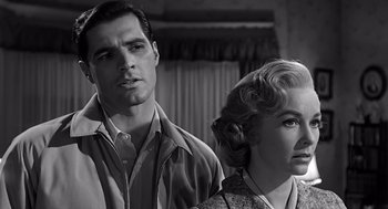 Movie still from “Psycho” (1960), directed by Alfred Hitchcock – A black and white photo of a man and a woman; Close Up shot, Low angle