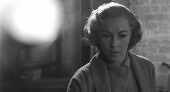 Movie still from “Psycho” (1960), directed by Alfred Hitchcock – A black - and - white photo of a woman with blonde hair; Close Up shot, Low angle