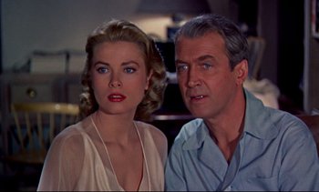 Movie still from “Rear Window” (1954), directed by Alfred Hitchcock – A man and a woman standing next to each other; Close Up shot, Low angle