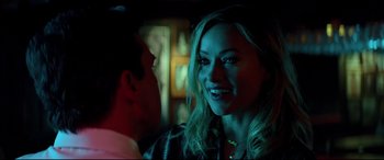 Movie still from “Richard Jewell” (2019), directed by Clint Eastwood – A man and a woman smiling at each other in the dark; Close Up shot, Over the shoulder angle