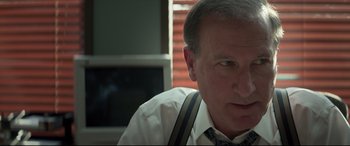 Movie still from “Richard Jewell” (2019), directed by Clint Eastwood – A person wearing a shirt and tie; Close Up shot, Over the shoulder angle
