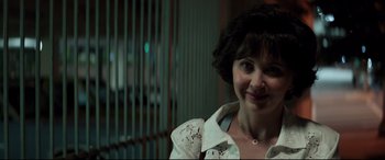 Movie still from “Richard Jewell” (2019), directed by Clint Eastwood – A person smiling for the camera; Close Up shot, Over the shoulder angle