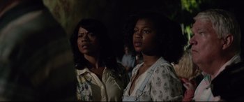 Movie still from “Richard Jewell” (2019), directed by Clint Eastwood – Two women standing next to each other in the dark; Close Up shot, Over the shoulder angle