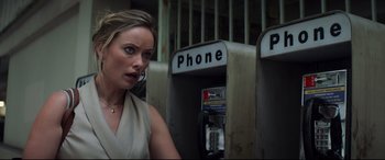 Movie still from “Richard Jewell” (2019), directed by Clint Eastwood – A woman standing in front of a pay phone; Close Up shot, High angle