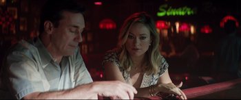 Movie still from “Richard Jewell” (2019), directed by Clint Eastwood – A woman sitting next to a man at a table; Medium shot, Over the shoulder angle