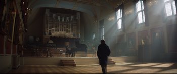 Movie still from “Rocketman” (2019), directed by Dexter Fletcher – A man standing in front of an organ in a church; Extreme Wide shot, Low angle