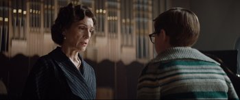 Movie still from “Rocketman” (2019), directed by Dexter Fletcher – A woman standing next to a man in front of an organ; Close Up shot, Over the shoulder angle