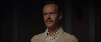 Movie still from “Rocketman” (2019), directed by Dexter Fletcher – A person wearing a sweater; Close Up shot, Over the shoulder angle