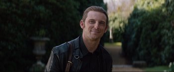 Movie still from “Rocketman” (2019), directed by Dexter Fletcher – A person wearing a leather jacket; Close Up shot, Over the shoulder angle