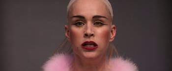 Movie still from “Romeo + Juliet” (1996), directed by Baz Luhrmann – A person with makeup on; Close Up shot, Low angle