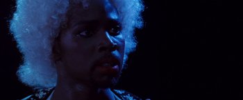 Movie still from “Romeo + Juliet” (1996), directed by Baz Luhrmann – A person with a beard; Close Up shot, Low angle