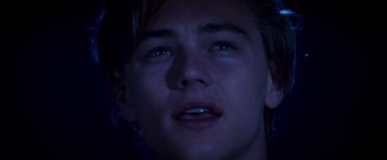 Movie still from “Romeo + Juliet” (1996), directed by Baz Luhrmann – A young man's face at night; Close Up shot, Low angle
