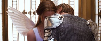 Movie still from “Romeo + Juliet” (1996), directed by Baz Luhrmann – A man and a woman are hugging each other; Close Up shot, Over the shoulder angle
