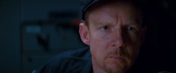 Movie still from “Romeo + Juliet” (1996), directed by Baz Luhrmann – A person wearing a hat; Close Up shot, Over the shoulder angle