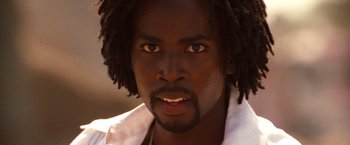 Movie still from “Romeo + Juliet” (1996), directed by Baz Luhrmann – A person with dreadlocks; Close Up shot, Low angle