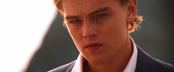 Movie still from “Romeo + Juliet” (1996), directed by Baz Luhrmann – A young man's face; Close Up shot, Low angle