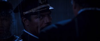 Movie still from “Romeo + Juliet” (1996), directed by Baz Luhrmann – A person wearing a hat; Close Up shot, Over the shoulder angle