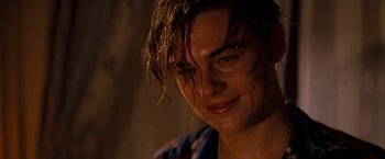 Movie still from “Romeo + Juliet” (1996), directed by Baz Luhrmann – A person with wet hair; Close Up shot, Low angle