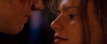 Movie still from “Romeo + Juliet” (1996), directed by Baz Luhrmann – A woman's face and ear; Extreme Close Up shot, Over the shoulder angle