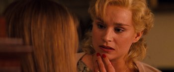 Movie still from “Romeo + Juliet” (1996), directed by Baz Luhrmann – A woman looking in the reflection of a mirror; Close Up shot, Over the shoulder angle