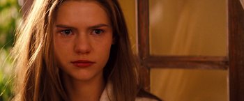 Movie still from “Romeo + Juliet” (1996), directed by Baz Luhrmann – A person's face in a room; Close Up shot, Over the shoulder angle