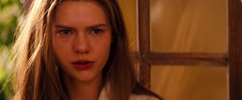 Movie still from “Romeo + Juliet” (1996), directed by Baz Luhrmann – A person with long brown hair; Close Up shot, Over the shoulder angle