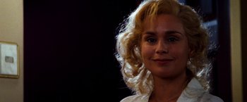 Movie still from “Romeo + Juliet” (1996), directed by Baz Luhrmann – A person with blonde hair; Close Up shot, Low angle