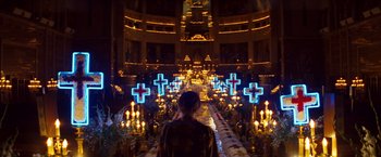 Movie still from “Romeo + Juliet” (1996), directed by Baz Luhrmann – A woman standing in a large room with candles; Extreme Wide shot, High angle