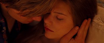Movie still from “Romeo + Juliet” (1996), directed by Baz Luhrmann – A person with their eyes closed; Close Up shot, Overhead angle