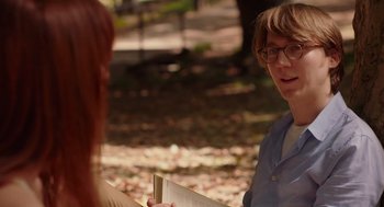Movie still from “Ruby Sparks” (2012), directed by Valerie Faris – Two people are talking in a park; Medium shot, Over the shoulder angle