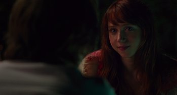 Movie still from “Ruby Sparks” (2012), directed by Valerie Faris – A person sitting in front of a plant; Close Up shot, Over the shoulder angle