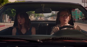 Movie still from “Ruby Sparks” (2012), directed by Valerie Faris – A man and a woman in the back seat of a car; Medium shot, Over the shoulder angle