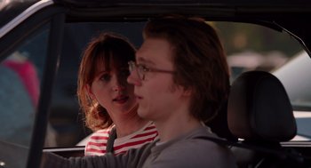 Movie still from “Ruby Sparks” (2012), directed by Valerie Faris – A man and a woman sitting in the back of a car; Close Up shot, Over the shoulder angle