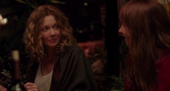 Movie still from “Ruby Sparks” (2012), directed by Valerie Faris – Two women are talking to each other in a restaurant; Medium shot, Over the shoulder angle
