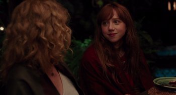 Movie still from “Ruby Sparks” (2012), directed by Valerie Faris – A woman with long red hair is talking to another woman; Close Up shot, Over the shoulder angle