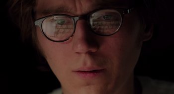 Movie still from “Ruby Sparks” (2012), directed by Valerie Faris – A person wearing glasses; Extreme Close Up shot, Low angle