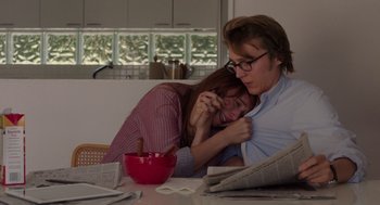 Movie still from “Ruby Sparks” (2012), directed by Valerie Faris – A man and a woman sitting at a dining room table; Medium shot, Over the shoulder angle