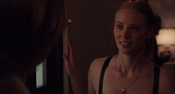 Movie still from “Ruby Sparks” (2012), directed by Valerie Faris – A beautiful young lady looking into a bathroom mirror; Close Up shot, Over the shoulder angle