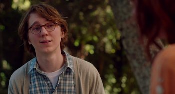 Movie still from “Ruby Sparks” (2012), directed by Valerie Faris – A young man wearing glasses and a plaid shirt; Close Up shot, Over the shoulder angle