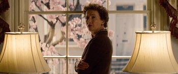 Movie still from “Saving Mr. Banks” (2013), directed by John Lee Hancock – A woman standing in front of a window with cherry blossoms; Close Up shot, Low angle