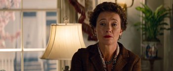 Movie still from “Saving Mr. Banks” (2013), directed by John Lee Hancock – An older woman in a brown jacket and a lamp; Close Up shot, Low angle
