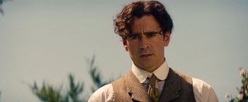 Movie still from “Saving Mr. Banks” (2013), directed by John Lee Hancock – A person wearing a suit and tie; Close Up shot, Over the shoulder angle