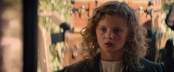 Movie still from “Saving Mr. Banks” (2013), directed by John Lee Hancock – A young girl with long curly hair; Close Up shot, High angle