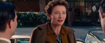 Movie still from “Saving Mr. Banks” (2013), directed by John Lee Hancock – An older woman wearing a brown jacket and a necklace; Close Up shot, Over the shoulder angle