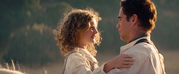 Movie still from “Saving Mr. Banks” (2013), directed by John Lee Hancock – A man and a woman standing next to each other; Close Up shot, Over the shoulder angle