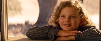 Movie still from “Saving Mr. Banks” (2013), directed by John Lee Hancock – A young girl is posing for a picture; Close Up shot, Over the shoulder angle