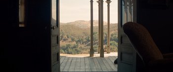 Movie still from “Saving Mr. Banks” (2013), directed by John Lee Hancock – A view of a valley from a porch with pillars; Wide shot, High angle