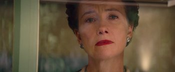 Movie still from “Saving Mr. Banks” (2013), directed by John Lee Hancock – An older woman with red lipstick looking out a window; Close Up shot, Low angle